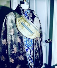 a mannequin with a jacket and a fanny pack